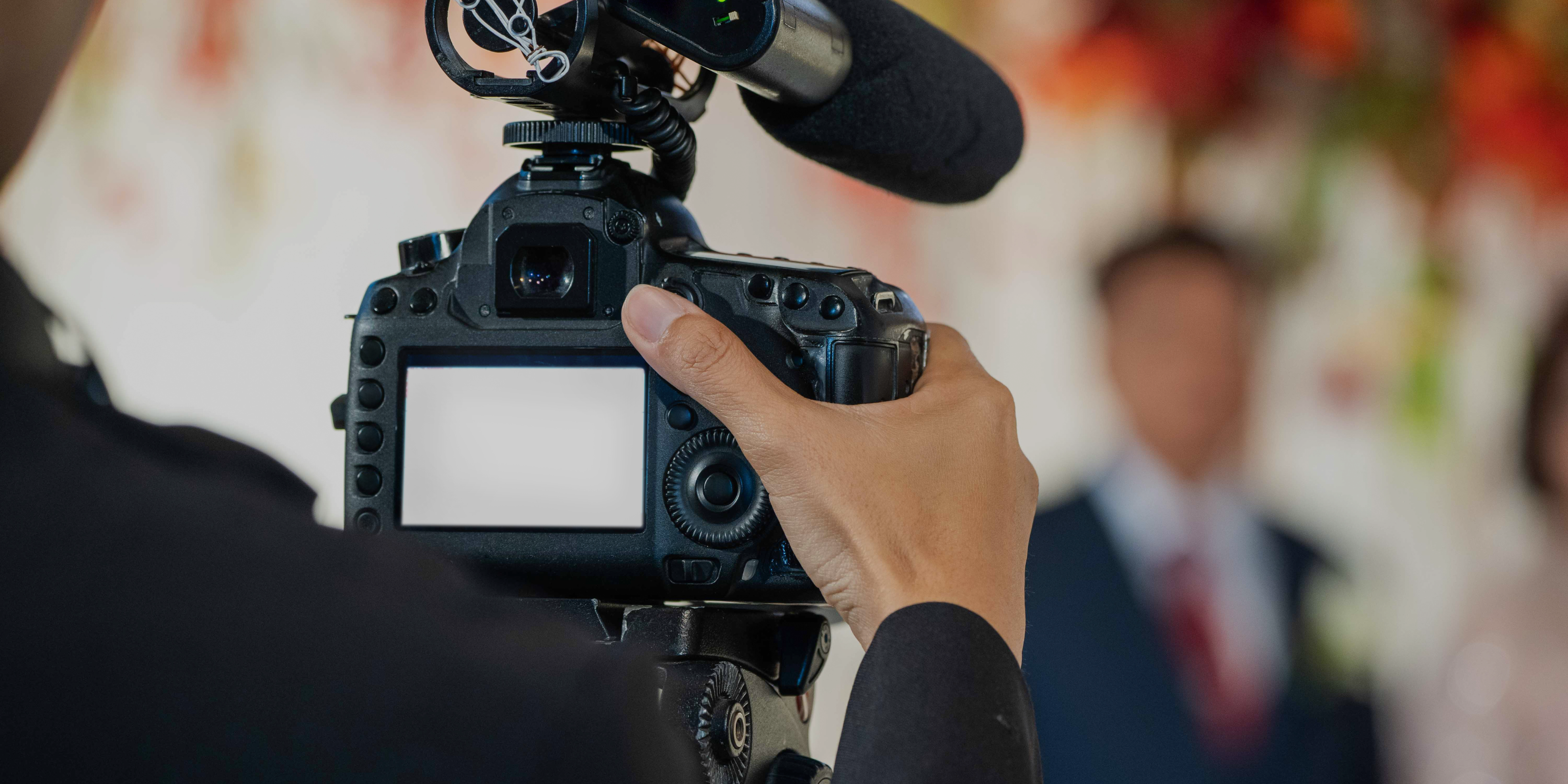 Camera Screen in front of a wedding couple