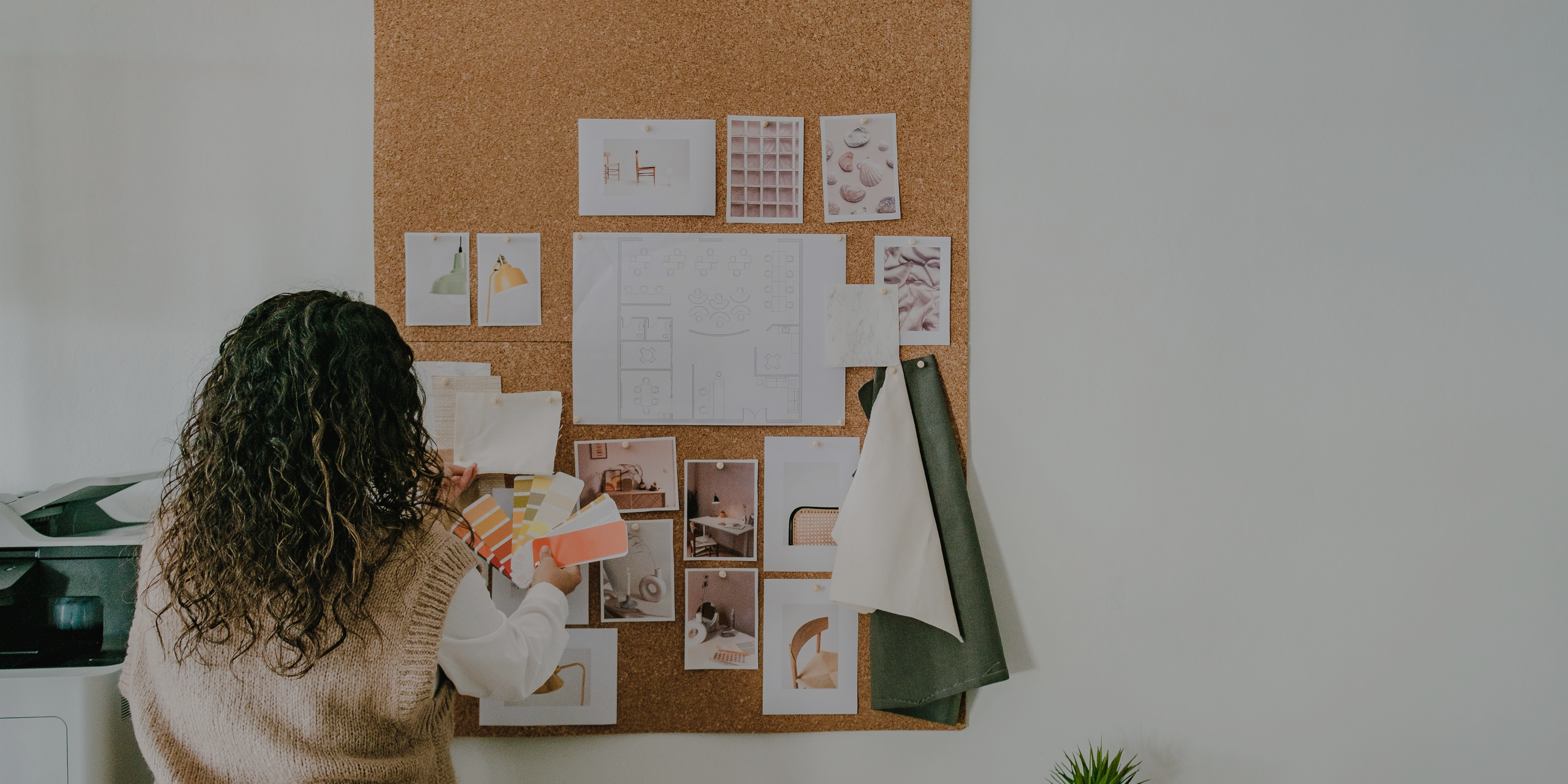 A Woman planning on a pinboard